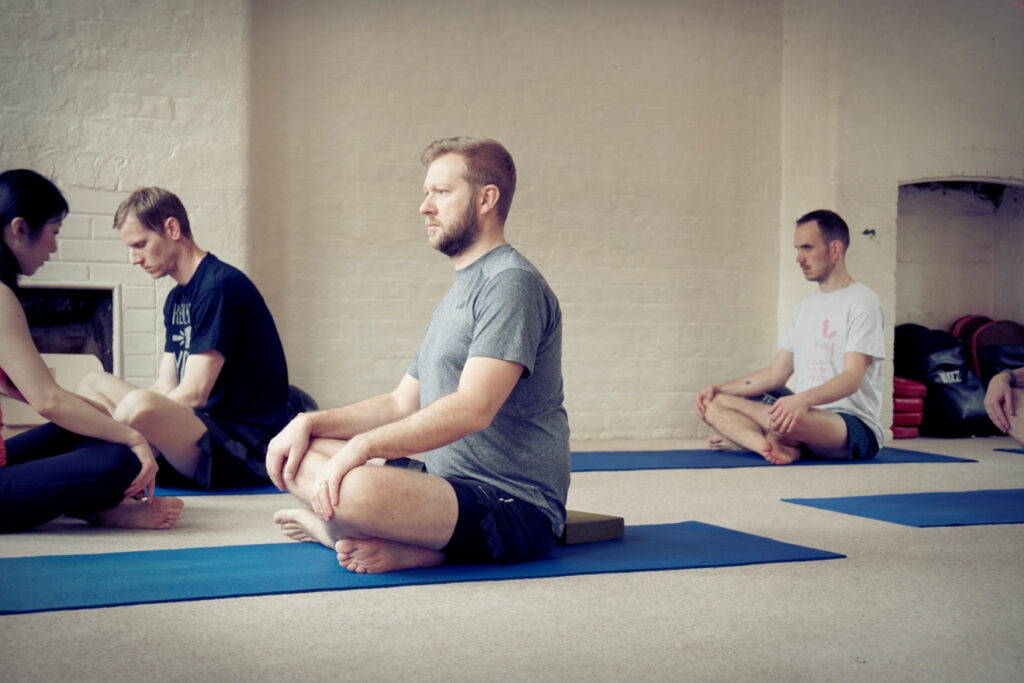 Yoga class with blue mats